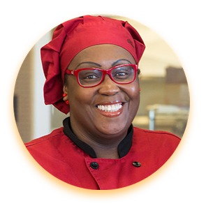 Rhonda Manning in a Chef Uniform.