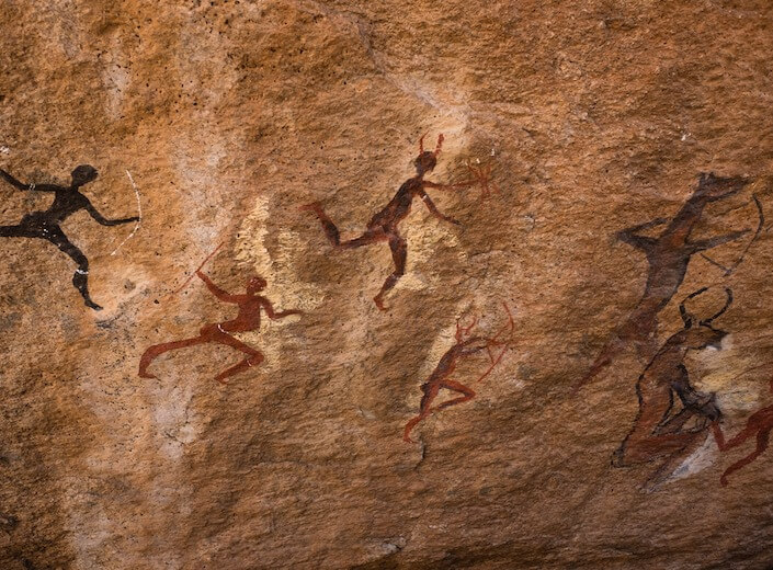 Cave drawings by early humans.