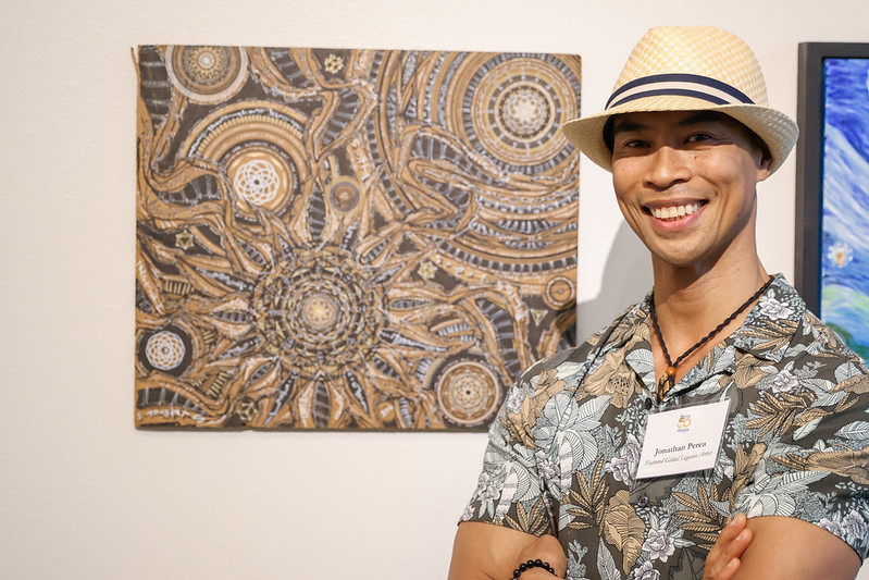 Man standing by art