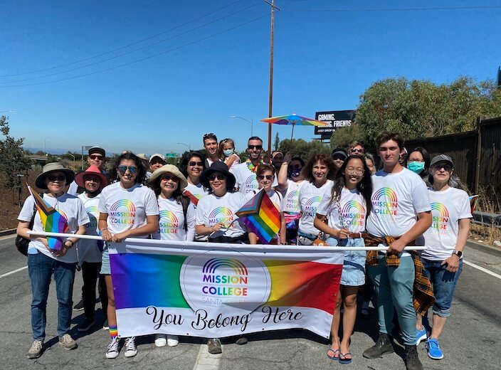 Group of faculty and staff holding a sign that reads "You Belong Here" at the Santa Clara Pride Parade,