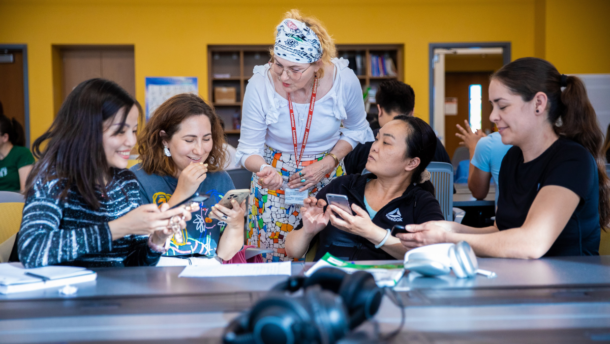Group of students working with teacher