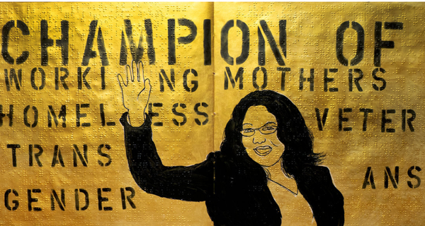 Woman smiling next to words