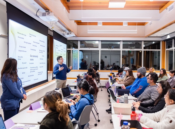 Full classroom of community college students listening to a lecture. 