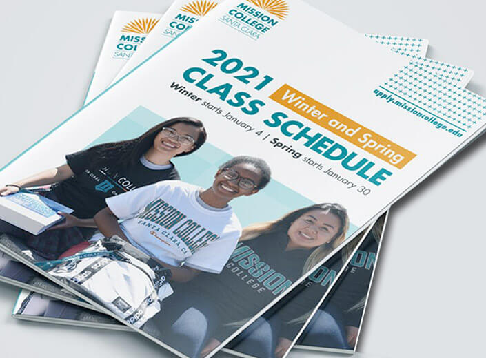 The front of the Mission College catalog. Three young women in Mission swag sit outside and smile.