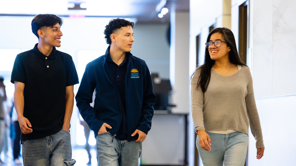 Smiling students walking in hallway