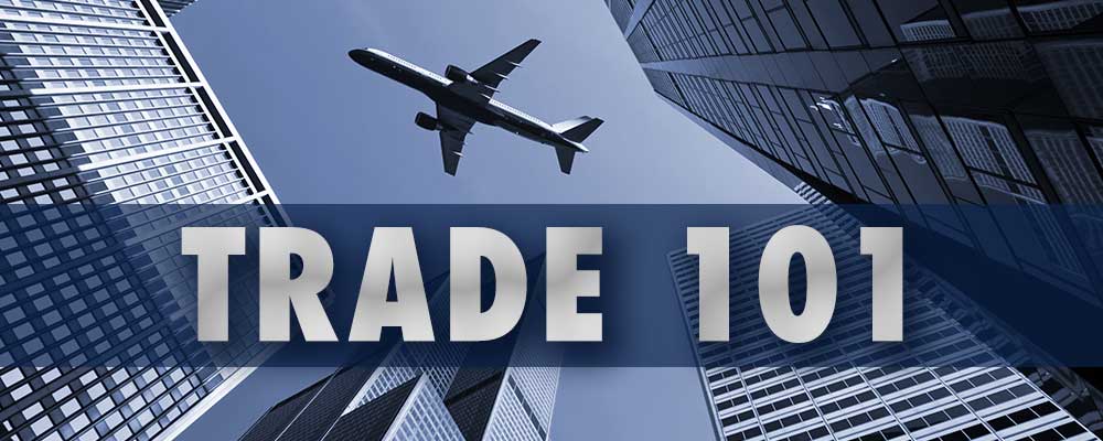 airplane flying over buildings with trade 101 as header