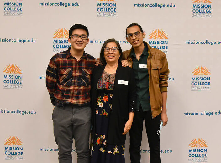 APIA Scholarship Award Ceremony 2022 - Three people stand in front of a backdrop that reads "Mission College"