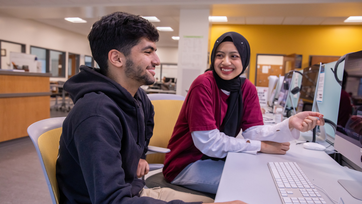 Academic support center tutor working with student
