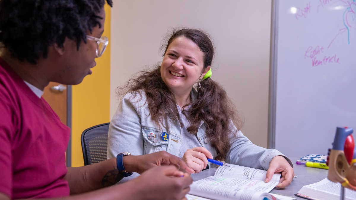 Academic support center tutor working with student