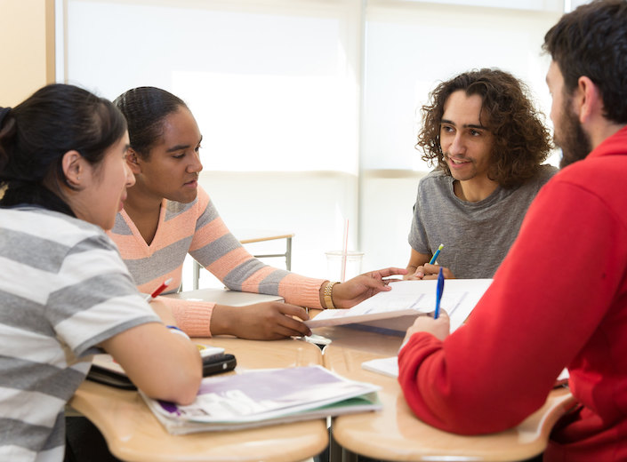Four students work together at a round table in the Academic Support Center at Mission College.