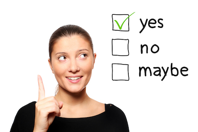 A young woman with dark brown hair pulled back picks "yes" out of three options. The other two options are "Maybe" and "No"