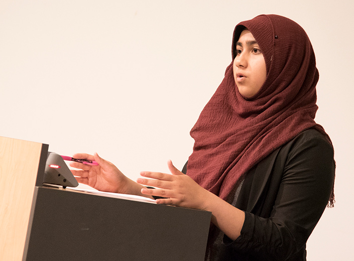 student speaking at a podium