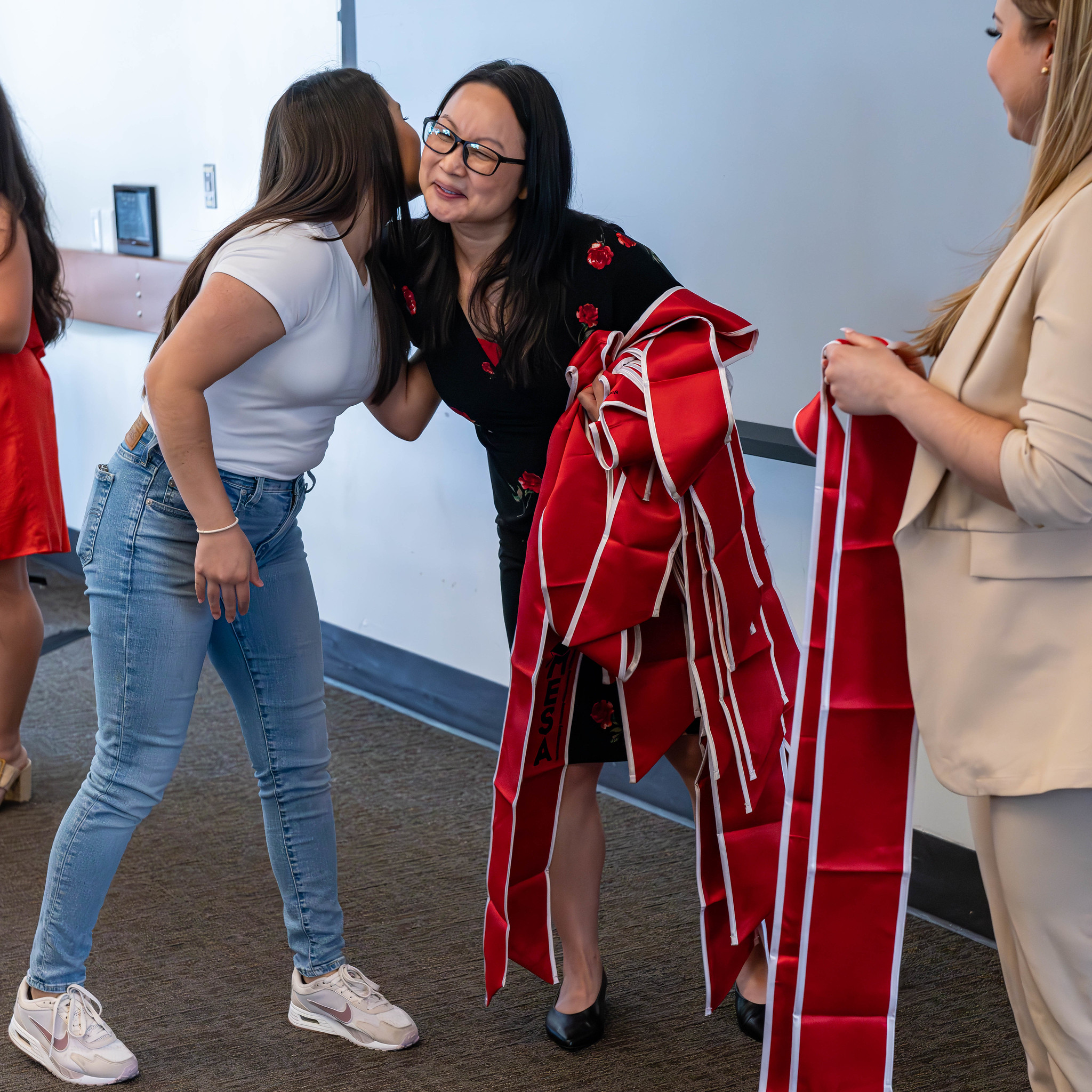 Students hugging at Mesa event
