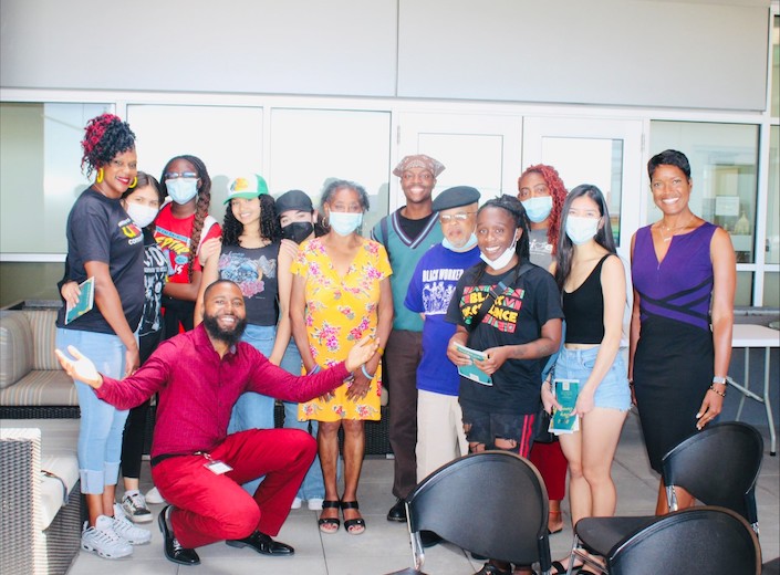 Umoja students and faculty pose together for a photo.