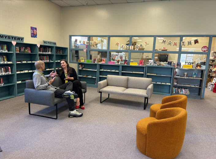 Staff connect inside the newly revitalized men’s library at the Elmwood Correctional Complex, a space designed to support learning, conversation, and personal growth.