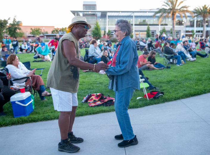 People enjoying concert