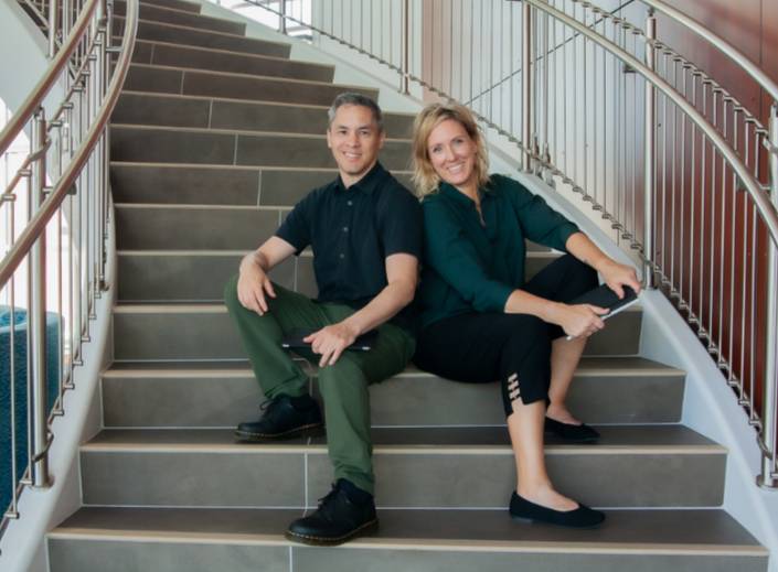 Kevin and Jeanine sitting on the stairs.