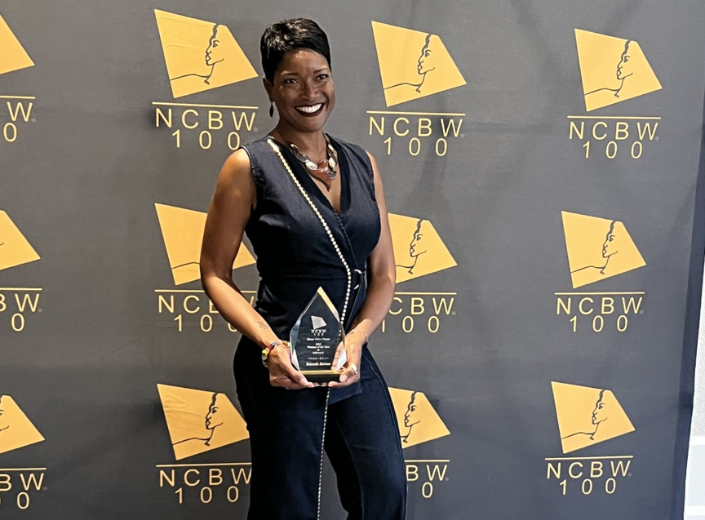Mission College Faculty member being recognized at event